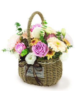 Arrangement of Gerberas, Eustoma, Ping Pong Chrysanthemum and a plenty of greens. Comes in a Rattan Flower Basket.